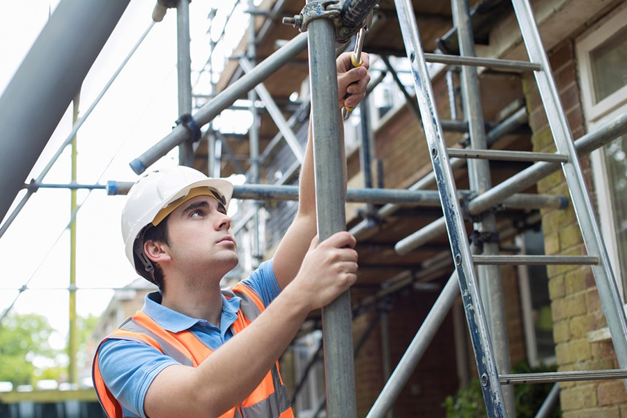 New construction worker wearing PPE at the start of a site career