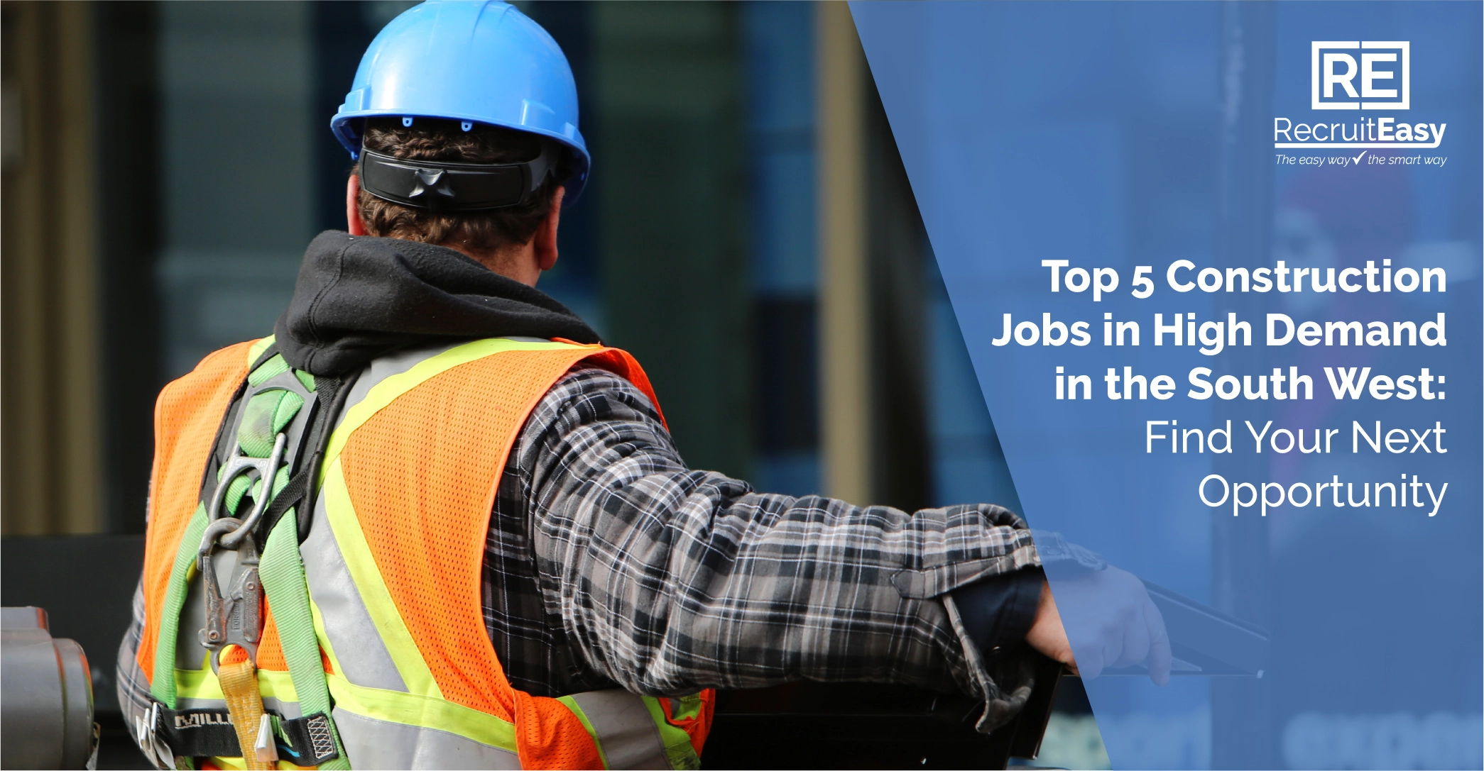 Construction worker wearing protective equipment on a construction site