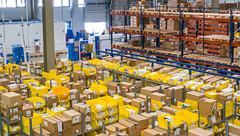 RecruitEasy Warehouse Workers Required shown with an aerial image of a warehouse with full shelves