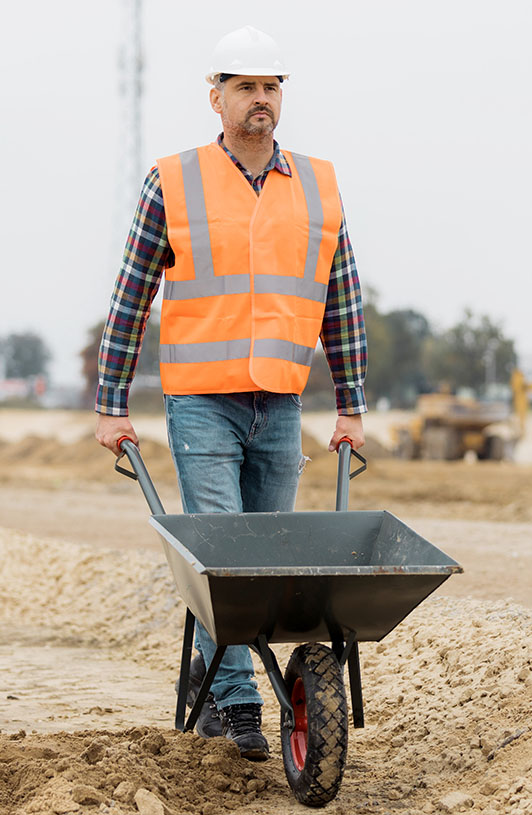 Groundworker with a wheel barrow
