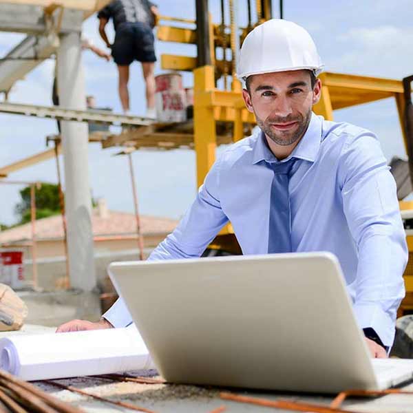 A square image showing a Quantity Surveyor at work
