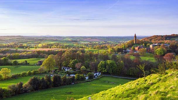 A view of the West Midlands showing a quaint market town with a church in the distance